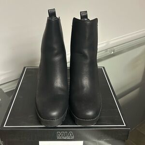 Francesca’s black booties